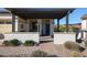 Covered patio with brick pavers and seating area at 17510 W Glenhaven Dr, Goodyear, AZ 85338