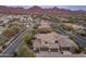 Aerial view of house and surrounding mountain views at 18514 N 94Th St, Scottsdale, AZ 85255