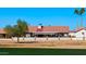 Back of house with covered patio and golf course view at 1968 Leisure World --, Mesa, AZ 85206