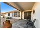 Covered entryway with tile flooring and seating for two at 1968 Leisure World --, Mesa, AZ 85206