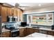 Kitchen features granite countertops and a view of the golf course at 1968 Leisure World --, Mesa, AZ 85206