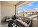 Relaxing balcony with comfortable seating and views of the neighborhood skyline at 19777 N 76Th St # 3246, Scottsdale, AZ 85255