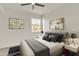 Serene bedroom with a large window and a comfortable queen-sized bed with gray accents at 19777 N 76Th St # 3246, Scottsdale, AZ 85255