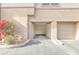 An open two-car garage with one bay having an automatic opener, and bougainvillea bush nearby at 19777 N 76Th St # 3246, Scottsdale, AZ 85255