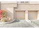 Two-car garage with a charming bougainvillea bush on the side of the building at 19777 N 76Th St # 3246, Scottsdale, AZ 85255