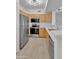 Modern kitchen with stainless steel appliances, light wood cabinets, and a breakfast bar at 19777 N 76Th St # 3246, Scottsdale, AZ 85255