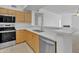 Bright kitchen boasts stainless steel appliances, light wood cabinets, and a breakfast bar at 19777 N 76Th St # 3246, Scottsdale, AZ 85255