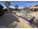 Well-kept pool area featuring lounge chairs, palm trees, and lush vegetation for a resort-like experience at 19777 N 76Th St # 3246, Scottsdale, AZ 85255