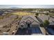 Aerial view of a single-story house with a large backyard and mountain views at 20121 W Lilac St, Buckeye, AZ 85326