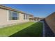 Artificial turf backyard with a view of the home's exterior at 20121 W Lilac St, Buckeye, AZ 85326