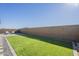 Landscaped backyard with artificial turf and patio at 20121 W Lilac St, Buckeye, AZ 85326