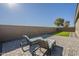 Landscaped backyard with artificial turf and patio furniture at 20121 W Lilac St, Buckeye, AZ 85326