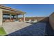 Artificial turf backyard with patio furniture and covered patio at 20121 W Lilac St, Buckeye, AZ 85326