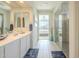 Spa-like bathroom with double vanity, a large walk-in shower, and a view of the bedroom at 20121 W Lilac St, Buckeye, AZ 85326