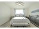 Bright bedroom with large windows and ceiling fan at 20121 W Lilac St, Buckeye, AZ 85326