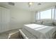 Comfortable bedroom with large windows, ceiling fan and en-suite bathroom at 20121 W Lilac St, Buckeye, AZ 85326