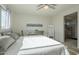 Spacious bedroom with large windows and ceiling fan at 20121 W Lilac St, Buckeye, AZ 85326