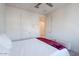 Bedroom with a queen bed and access to a bathroom at 20121 W Lilac St, Buckeye, AZ 85326