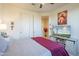 Spacious bedroom with a king-size bed, TV, and plenty of storage at 20121 W Lilac St, Buckeye, AZ 85326