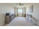 Cozy bedroom with window seating, ceiling fan, and plenty of natural light at 20121 W Lilac St, Buckeye, AZ 85326