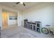 Spacious bedroom with large windows and built-in entertainment center at 20121 W Lilac St, Buckeye, AZ 85326
