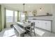 Bright dining area with a large farmhouse table and built-in cabinetry at 20121 W Lilac St, Buckeye, AZ 85326