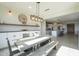 Bright dining area with farmhouse table and bench seating, adjacent to kitchen at 20121 W Lilac St, Buckeye, AZ 85326