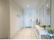 Light and airy entryway with a console table and mirrors at 20121 W Lilac St, Buckeye, AZ 85326