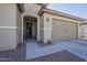 Front entry and two-car garage with walkway at 20121 W Lilac St, Buckeye, AZ 85326