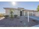 Single-story home with desert landscaping and two-car garage at 20121 W Lilac St, Buckeye, AZ 85326