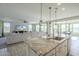 Kitchen with granite countertops, stainless steel appliances, and an island at 20121 W Lilac St, Buckeye, AZ 85326