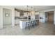 Modern kitchen with granite countertops and island with seating at 20121 W Lilac St, Buckeye, AZ 85326