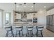 Modern kitchen with granite island and white cabinets at 20121 W Lilac St, Buckeye, AZ 85326