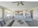 Spacious living room with a sectional sofa and large TV at 20121 W Lilac St, Buckeye, AZ 85326