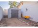 Backyard with shed and wheelbarrow at 2918 E Des Moines St, Mesa, AZ 85213