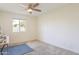 Bright bedroom with ceiling fan and carpet flooring at 2918 E Des Moines St, Mesa, AZ 85213