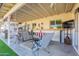 Covered patio with seating and backyard view at 2918 E Des Moines St, Mesa, AZ 85213