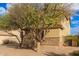 Side view of two-story house with stone accents at 30449 N Gunderson Dr, San Tan Valley, AZ 85143