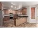 Kitchen with wood cabinets, stainless steel appliances, and an island at 30449 N Gunderson Dr, San Tan Valley, AZ 85143