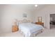 Bright bedroom with a queen bed and ensuite bathroom access at 321 W Betsy Ln, Gilbert, AZ 85233