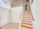 Bright entryway featuring tile flooring, a staircase, and a stylish window above the front door at 321 W Betsy Ln, Gilbert, AZ 85233