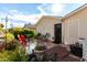 Backyard patio with red chairs and landscaping at 3301 S Goldfield Rd # 2068, Apache Junction, AZ 85119