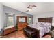Spacious bedroom with wooden furniture and a ceiling fan at 3301 S Goldfield Rd # 2068, Apache Junction, AZ 85119