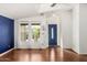 Entryway with hardwood floors and a blue accent wall at 3301 S Goldfield Rd # 2068, Apache Junction, AZ 85119