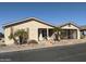 Tan single-story home with palm trees and carport at 3301 S Goldfield Rd # 2068, Apache Junction, AZ 85119