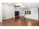 Open living area with hardwood floors and an adjacent kitchen at 3301 S Goldfield Rd # 2068, Apache Junction, AZ 85119