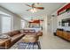 Living room features a brown leather sectional sofa and a modern coffee table at 3537 N San Gabriel Cir, Mesa, AZ 85215