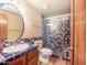 Bathroom with a shower, tile finishes and rounded mirror at 37222 N Tom Darlington Dr # 6, Carefree, AZ 85377