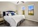 Spacious bedroom with plush bed and large windows at 4350 E Kings Ave, Phoenix, AZ 85032