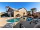 Inviting kidney-shaped pool with lounge chairs in the backyard at 474 E Jasper Dr, Gilbert, AZ 85296